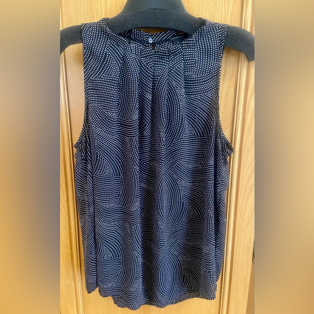 Ann Taylor sleeveless blouse. Button closure at neckline.